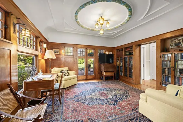 a dining room with a large window and couch