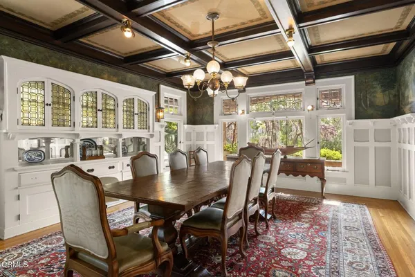 a large kitchen with a table and chairs