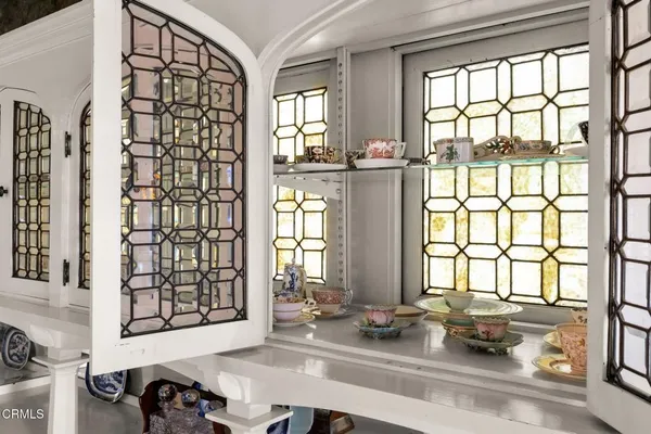 a view of a hallway with furniture and stairs