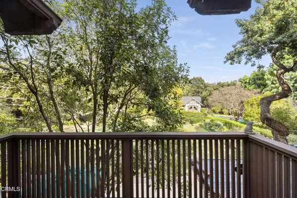a outdoor space with patio furniture and a flat screen tv
