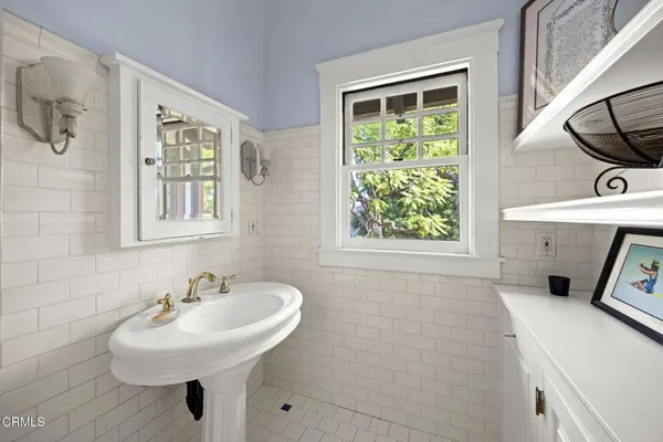 a view of a porch with potted plants
