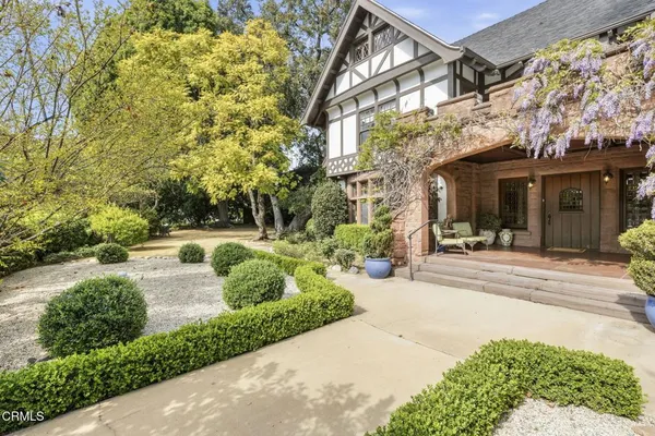 a living room with rug furniture and a fireplace