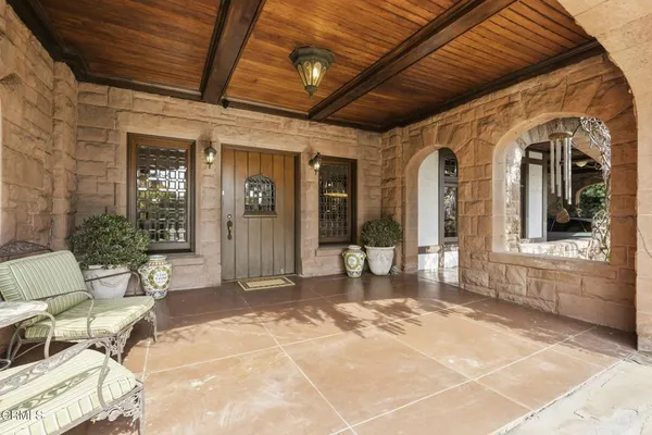 a living room with furniture window and wooden floor