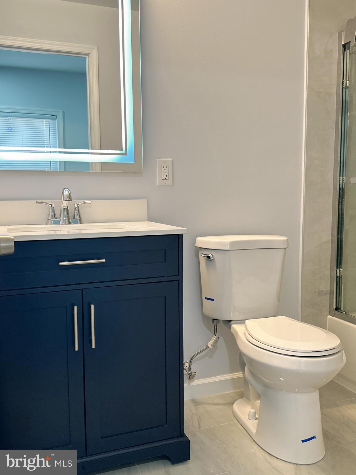 2854 Angus Road Philadelphia, PA 19114 - Photo 14 of 27 a bathroom with a toilet sink and mirror