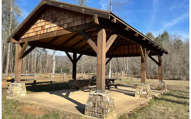 a view of sitting area with swimming pool in backyard