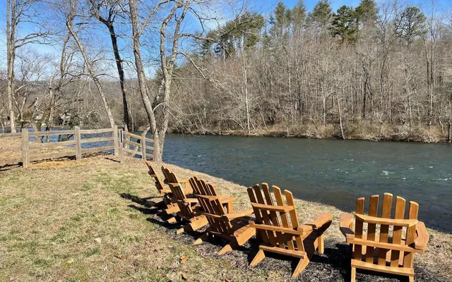 a view of a lake with outdoor seating