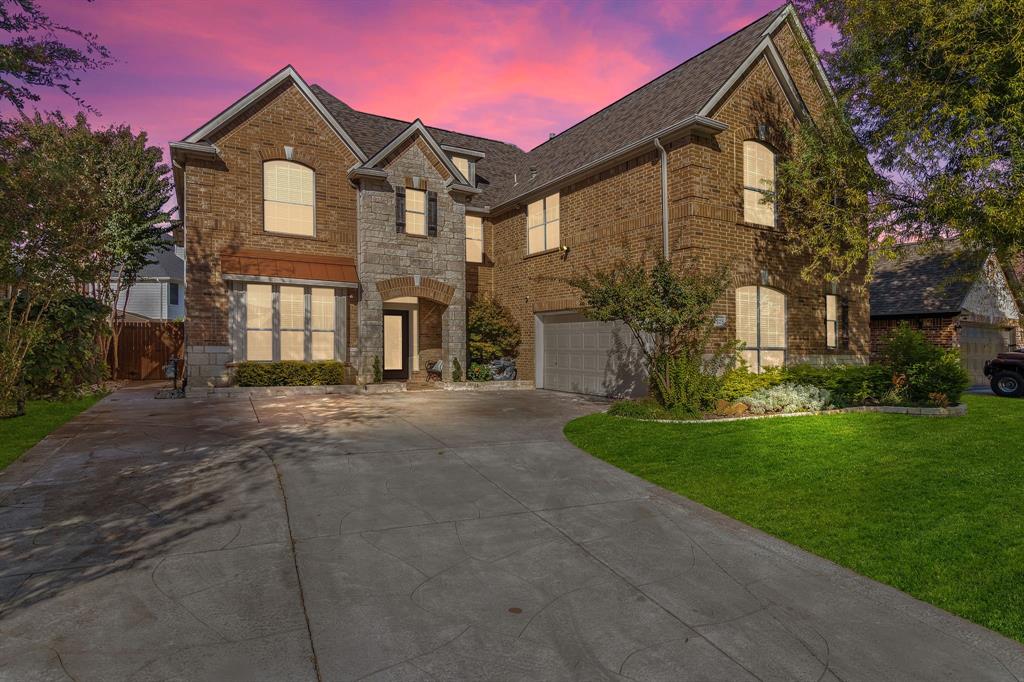 2228 Condor Street Grand Prairie, TX 75052 - Photo 1 of 33 a front view of a house with a yard and garage