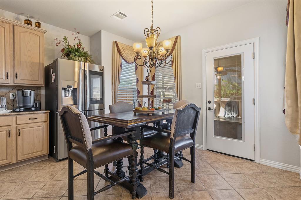 2228 Condor Street Grand Prairie, TX 75052 - Photo 20 of 33 a dining room with furniture and window