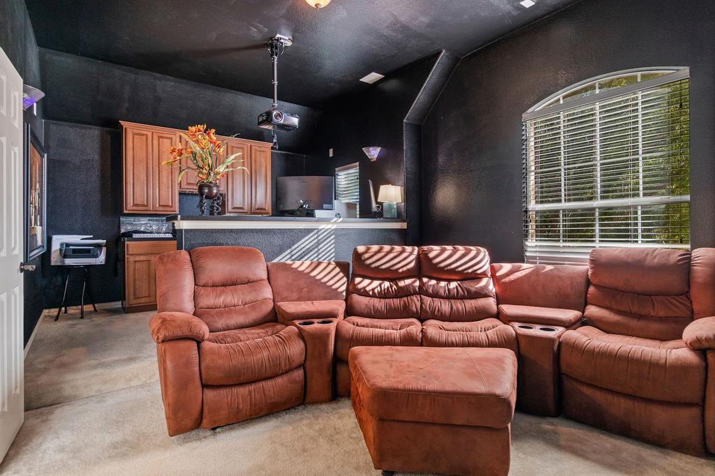 2228 Condor Street Grand Prairie, TX 75052 - Photo 21 of 33 a outdoor living space with furniture and a fireplace