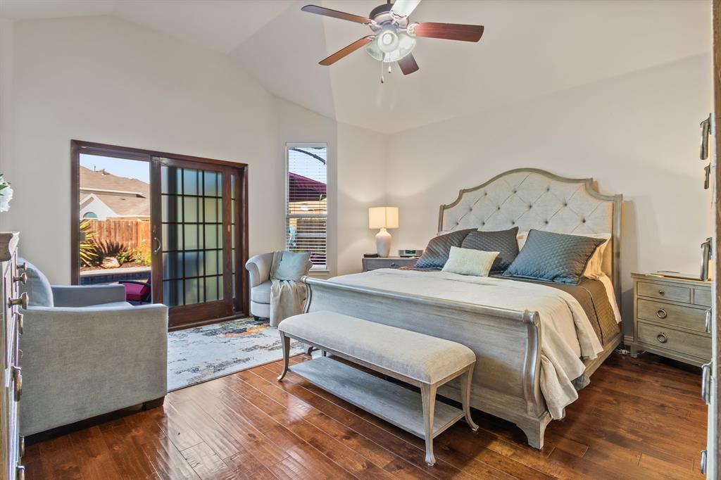 2228 Condor Street Grand Prairie, TX 75052 - Photo 29 of 33 a spacious bedroom with a bed a couch and a window