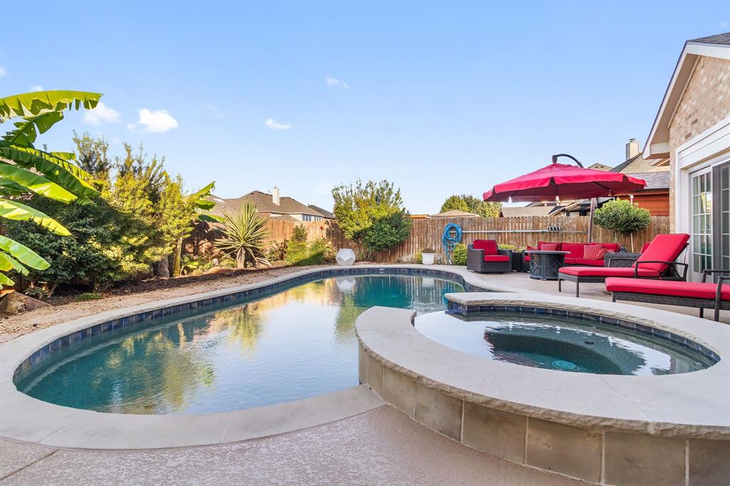 2228 Condor Street Grand Prairie, TX 75052 - Photo 33 of 33 a view of swimming pool with a potted plants and palm tree