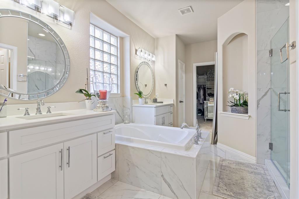 2228 Condor Street Grand Prairie, TX 75052 - Photo 4 of 33 a bathroom with a sink a vanity and a mirror