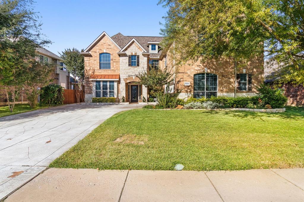 2228 Condor Street Grand Prairie, TX 75052 - Photo 6 of 33 a front view of house with yard and green space