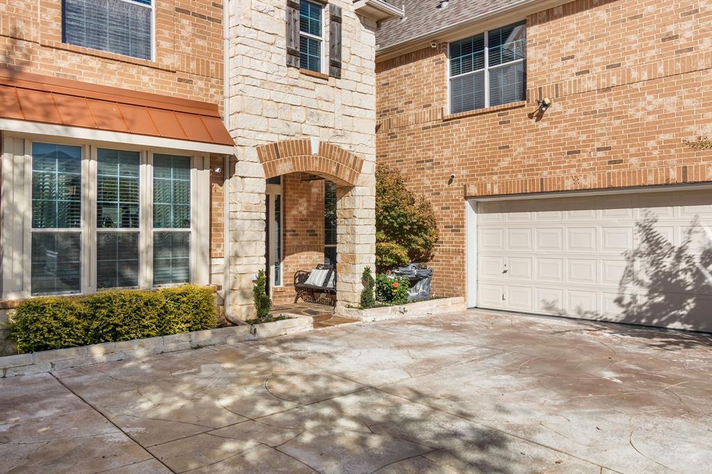 2228 Condor Street Grand Prairie, TX 75052 - Photo 8 of 33 front view of a brick house with a yard