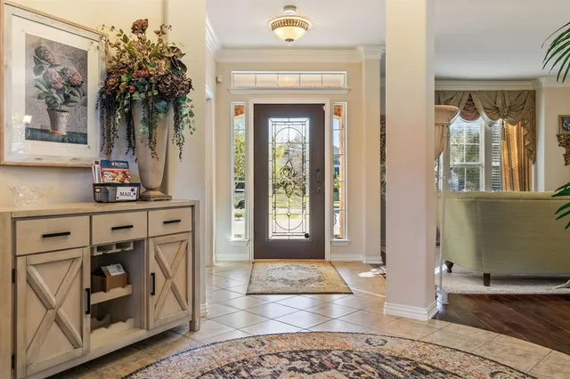 a view of a hallway with windows and dining room