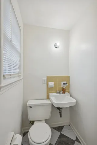 a front view of a house with table and chairs