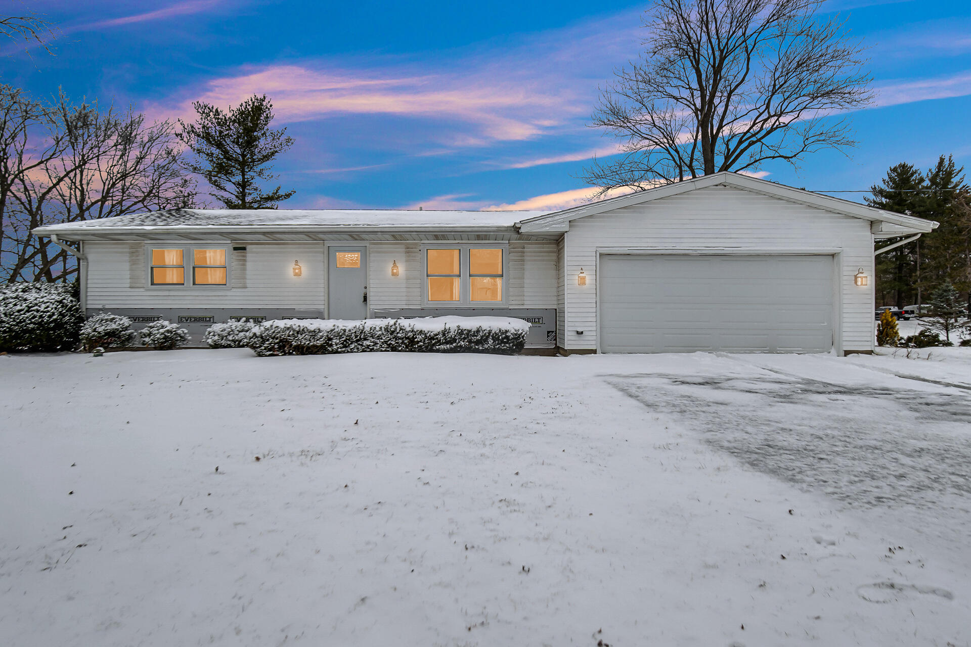 7210 East 97th Avenue Crown Point, IN 46307 - Photo 1 of 25 a front view of a house with a yard