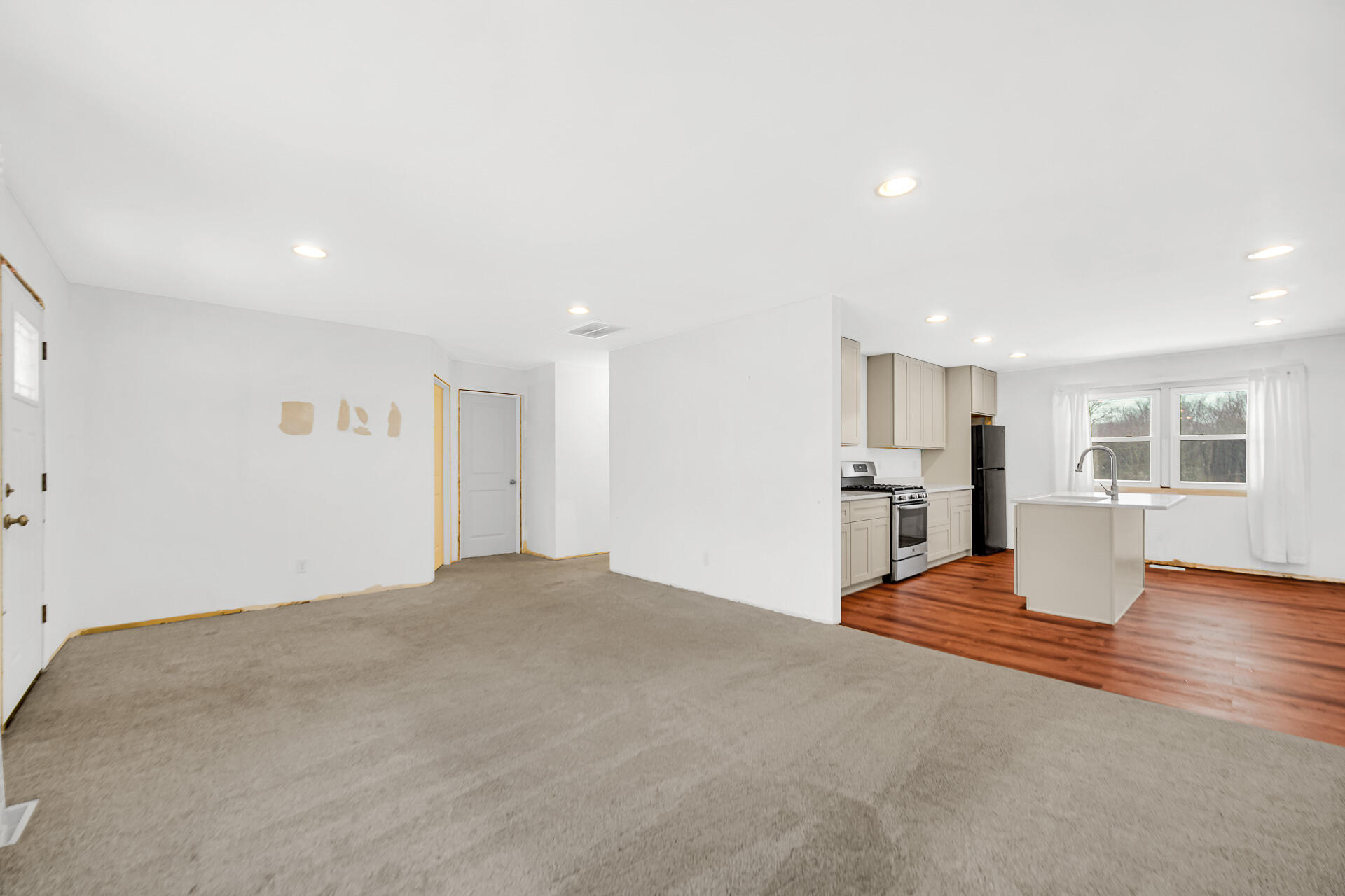7210 East 97th Avenue Crown Point, IN 46307 - Photo 11 of 25 a view of empty room with wooden floor