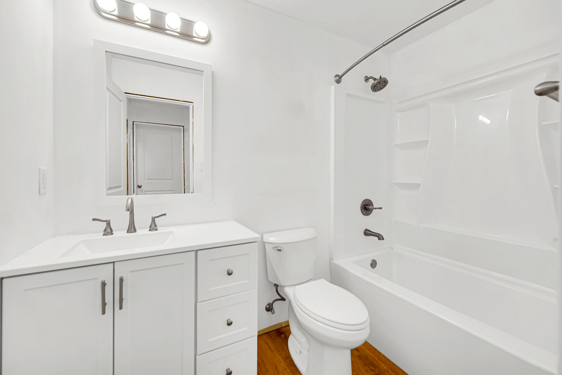 7210 East 97th Avenue Crown Point, IN 46307 - Photo 17 of 25 a bathroom with a sink toilet vanity and bathtub