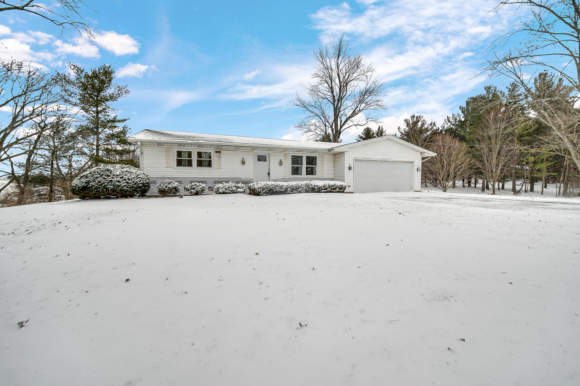 7210 East 97th Avenue Crown Point, IN 46307 - Photo 20 of 25 a front view of house with yard and trees