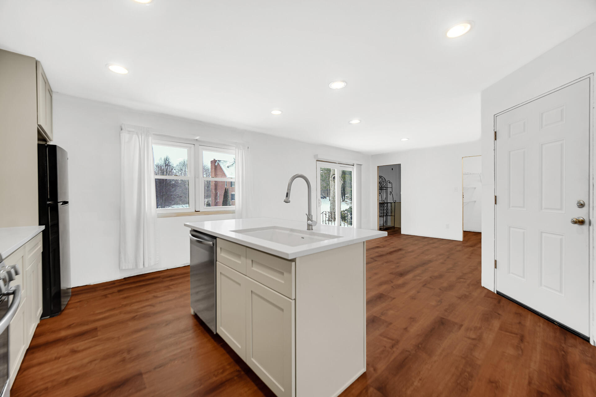7210 East 97th Avenue Crown Point, IN 46307 - Photo 5 of 25 a kitchen with stainless steel appliances granite countertop a sink stove and refrigerator