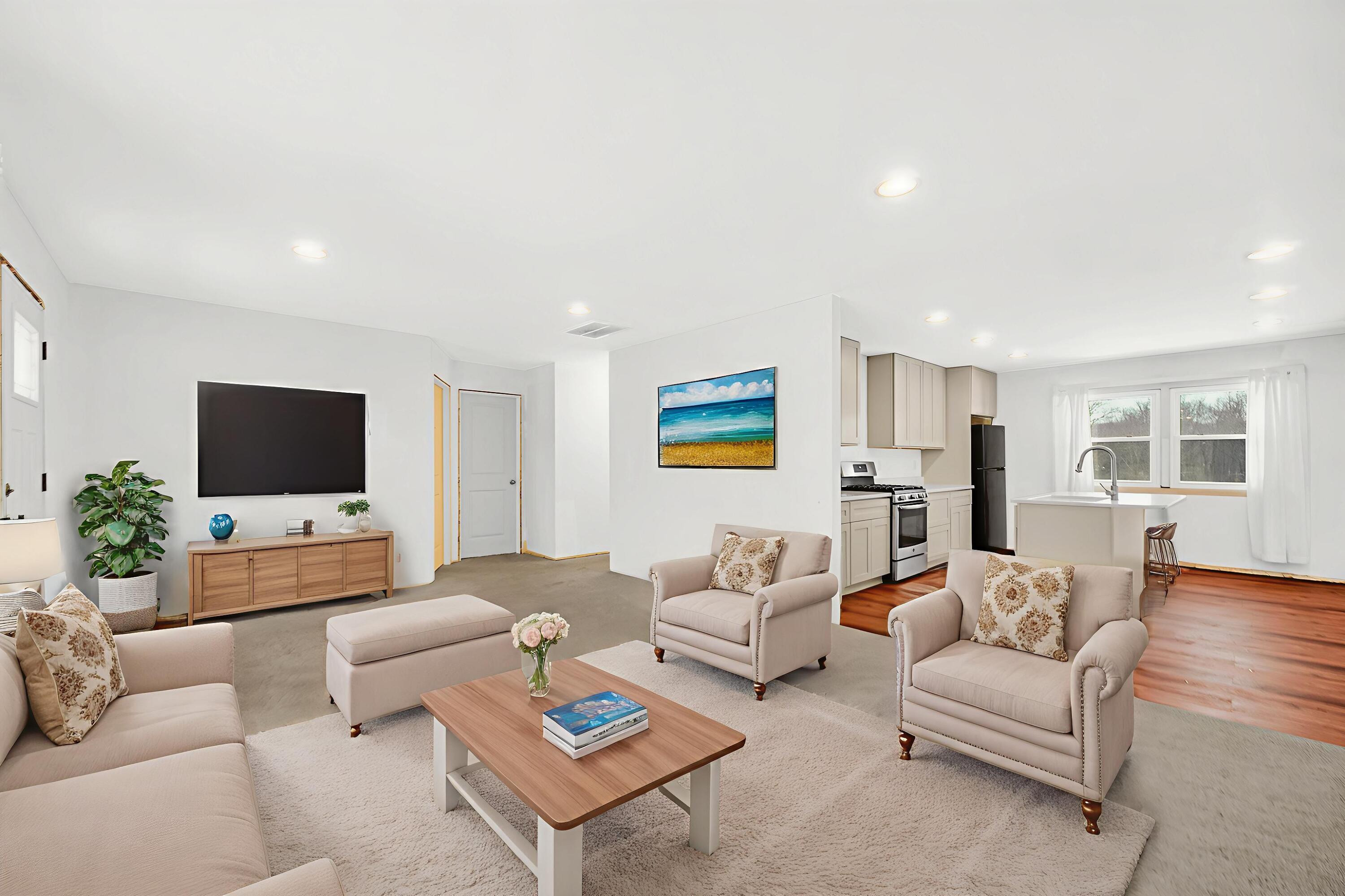 7210 East 97th Avenue Crown Point, IN 46307 - Photo 10 of 25 a living room with furniture kitchen view and a flat screen tv