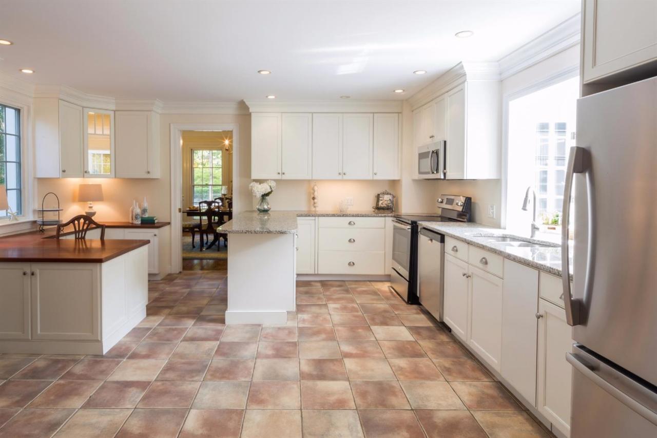 490 Main Street Centerville, MA 02632 - Photo 17 of 35 a kitchen with a sink a counter top space and cabinets