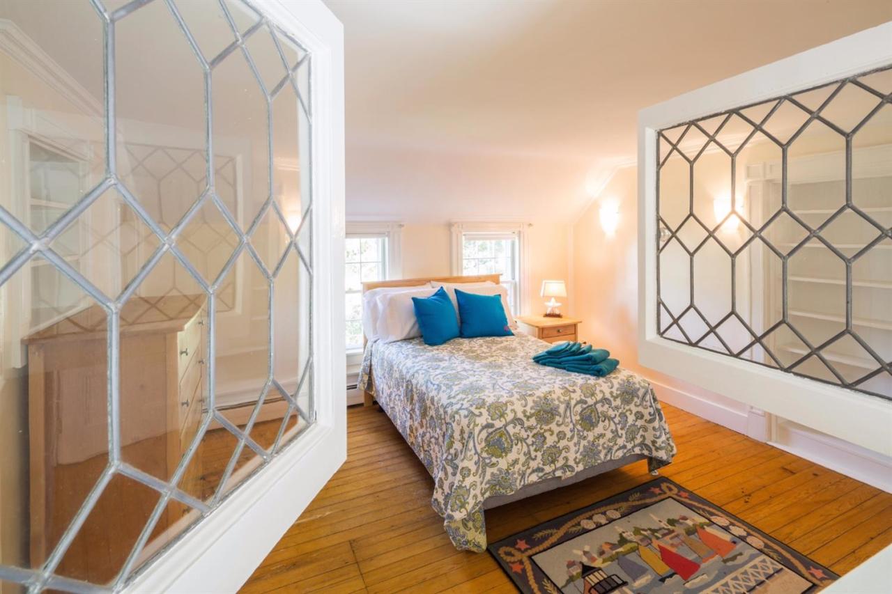 490 Main Street Centerville, MA 02632 - Photo 26 of 35 a bedroom with a bed and a window