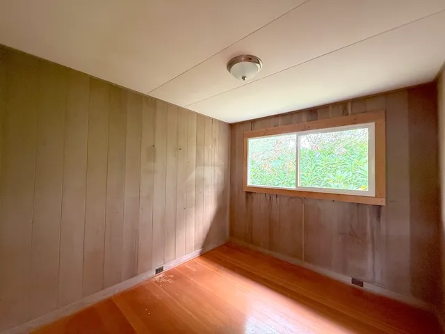 a view of an empty room and window