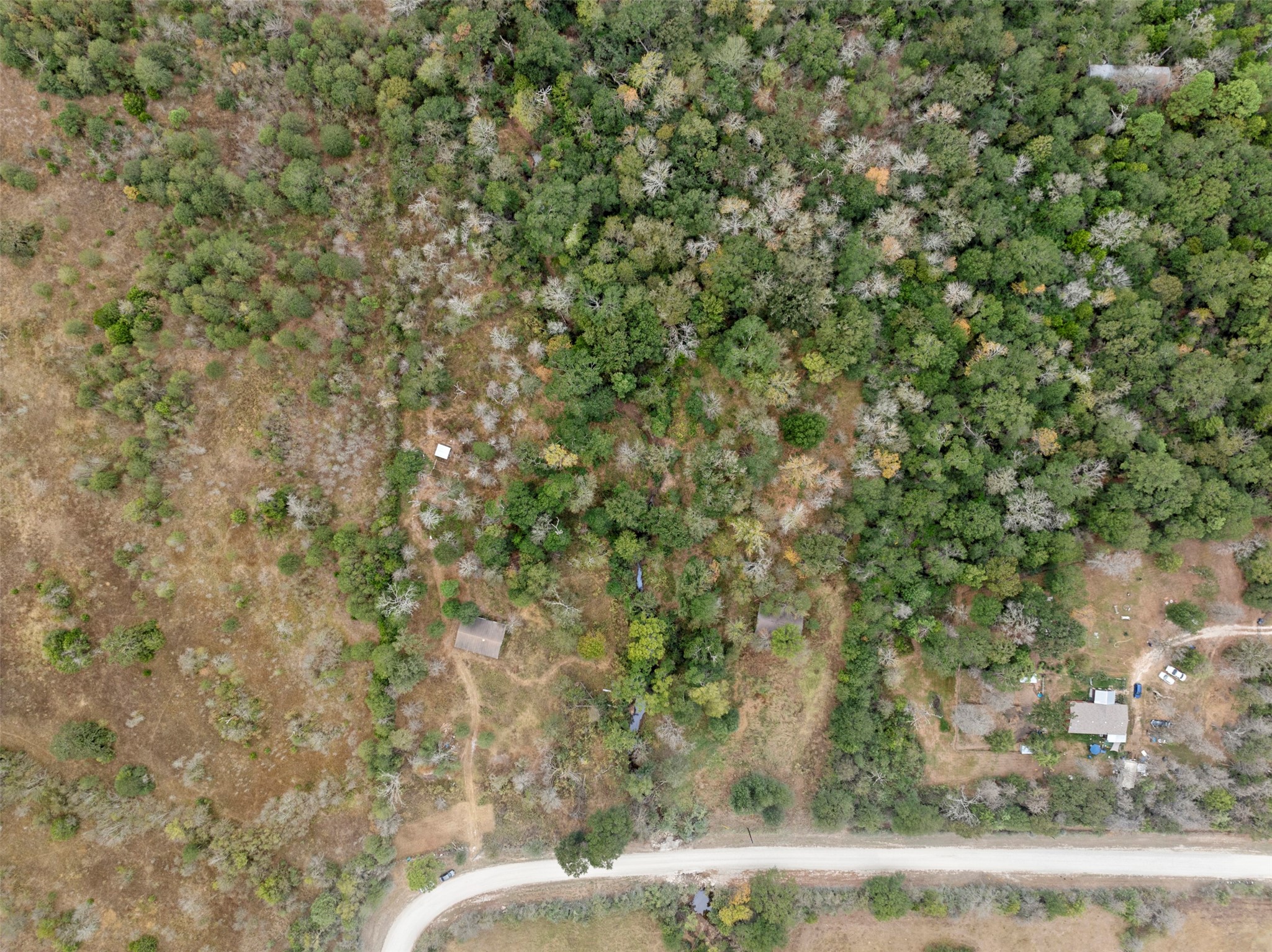 0 Outback Alley Bedias, TX 77831 - Photo 2 of 16 This 5.003 -acre property offers a stunning mix of open land and lush greenery, perfect for creating a serene, private retreat in the countryside.
