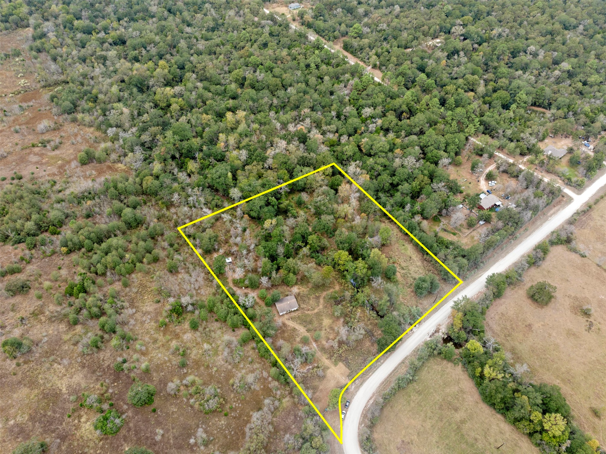 0 Outback Alley Bedias, TX 77831 - Photo 3 of 16 Surrounded by mature trees, this lot provides natural privacy and a tranquil atmosphere, ideal for those who love nature and seclusion.