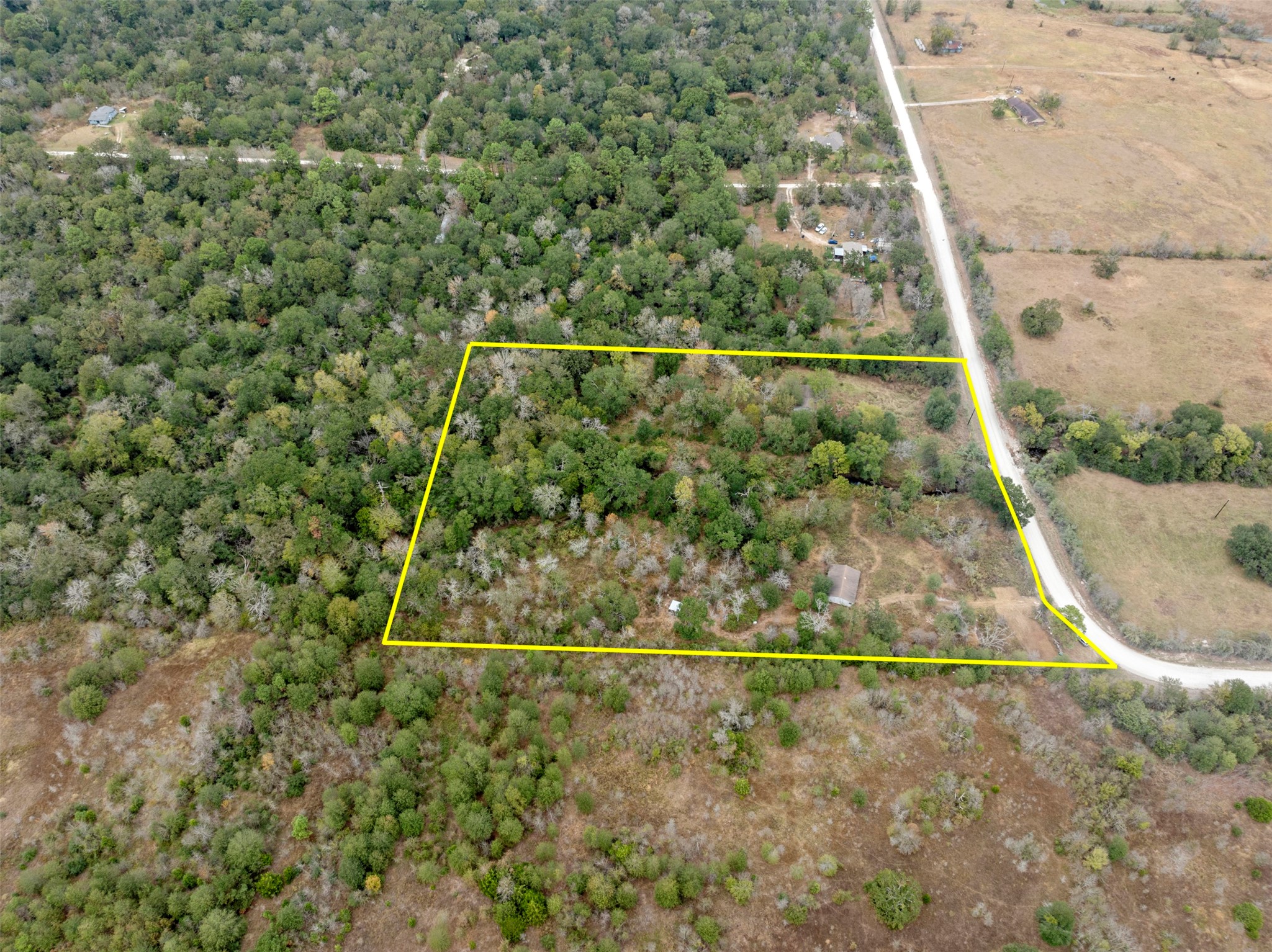 0 Outback Alley Bedias, TX 77831 - Photo 5 of 16 With a cleared area near the road, this property offers convenient access, making it easy to envision your future driveway or entryway.