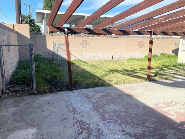 a view of a backyard of the house
