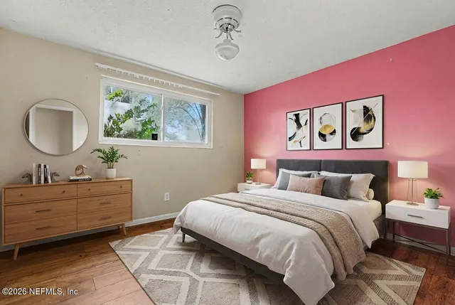 a bedroom with a bed and a dresser