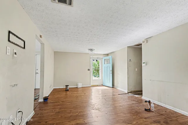 a view of a livingroom with wooden floor