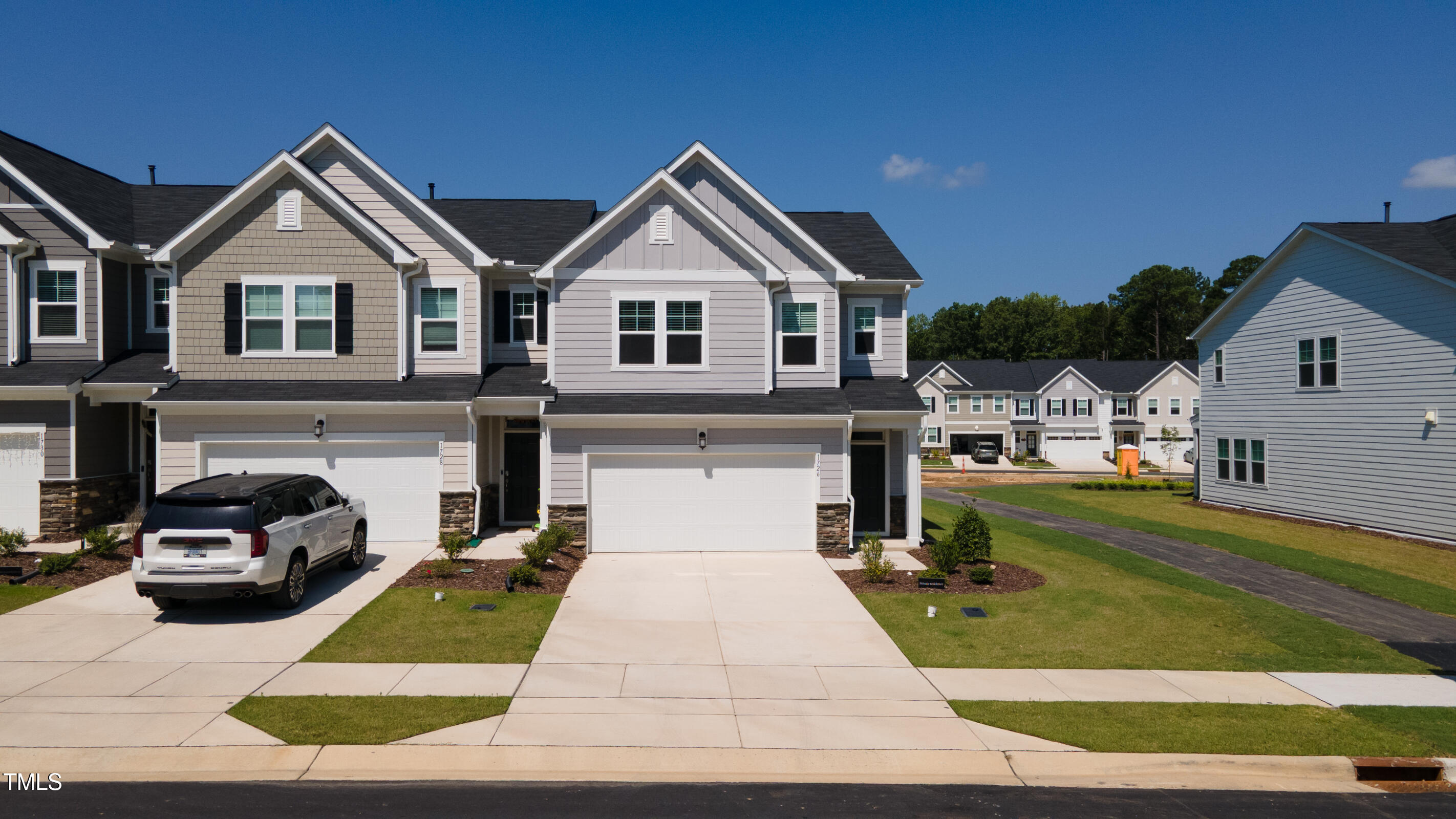 1726 Barrett Run Trail Apex, NC 27502 - Photo 2 of 50 a view of a white house with a yard