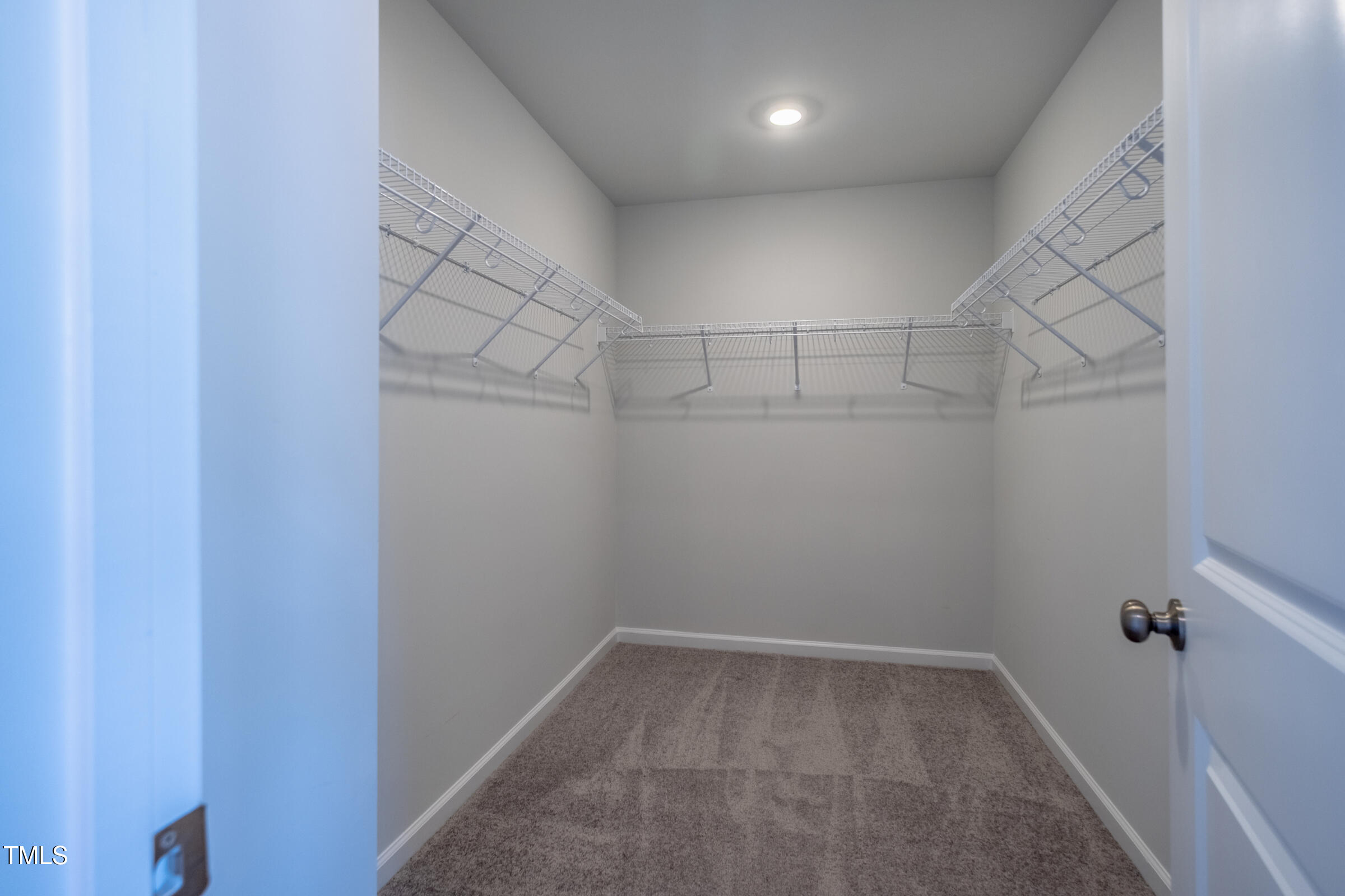 1726 Barrett Run Trail Apex, NC 27502 - Photo 31 of 50 a view of a room with racks on the wall