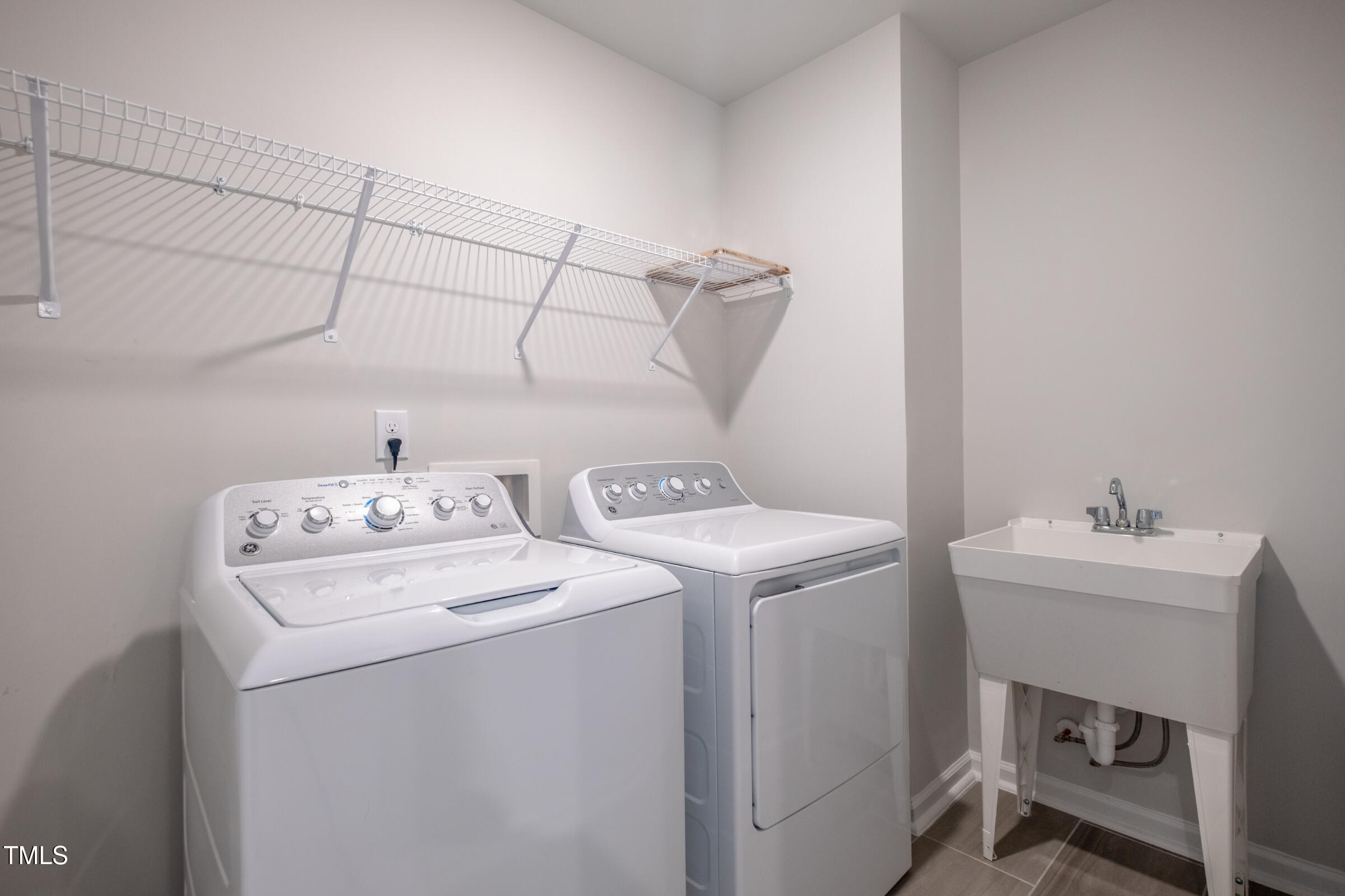 1726 Barrett Run Trail Apex, NC 27502 - Photo 36 of 50 a utility room with dryer and washer