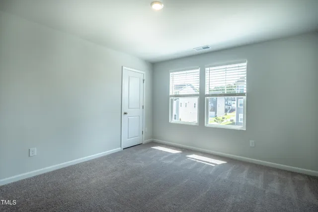 an aerial view of buildings with yard