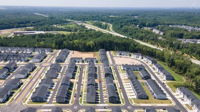 an aerial view of a house with a garden