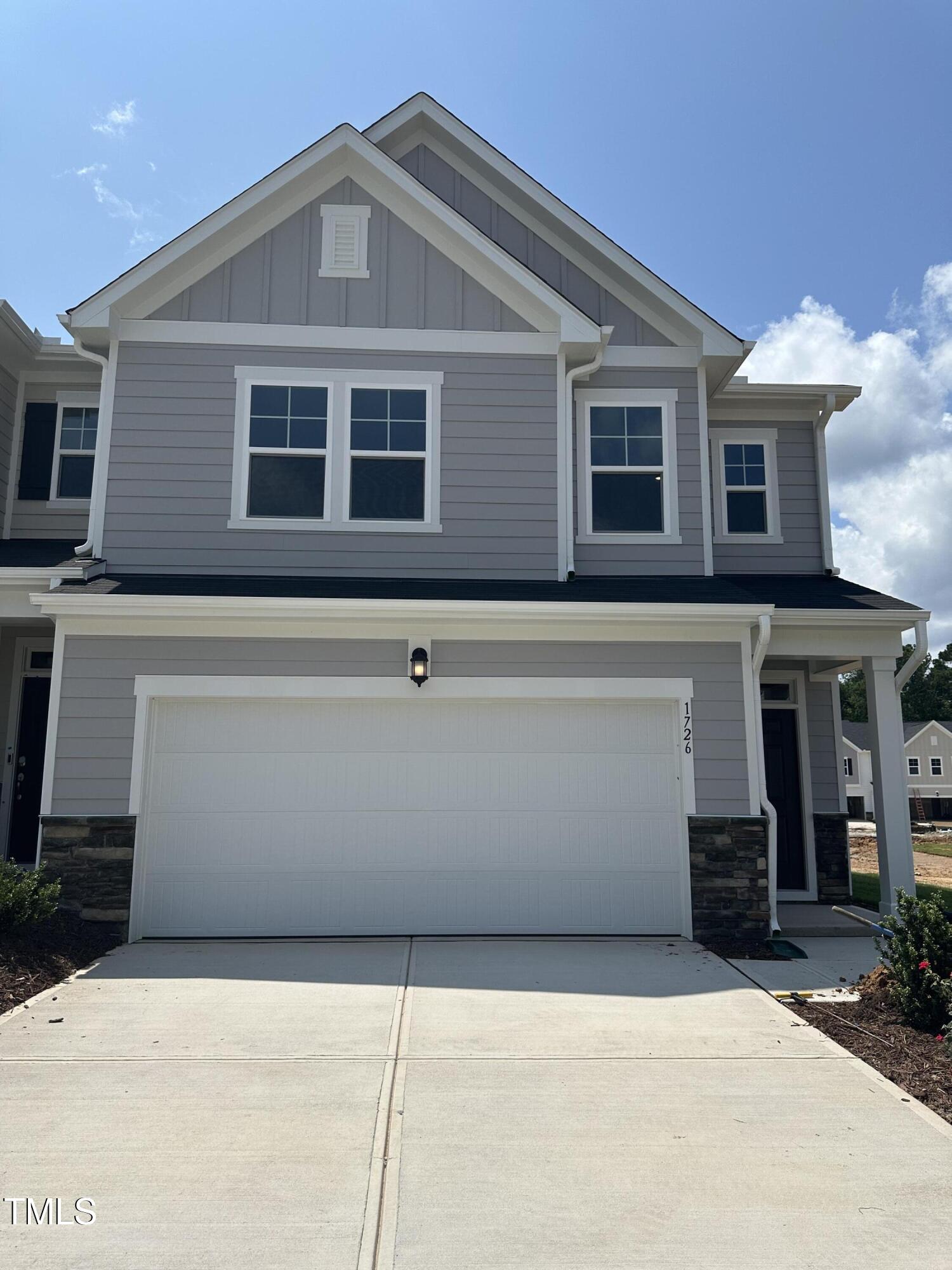 1726 Barrett Run Trail Apex, NC 27502 - Photo 5 of 50 a front view of a house with garage