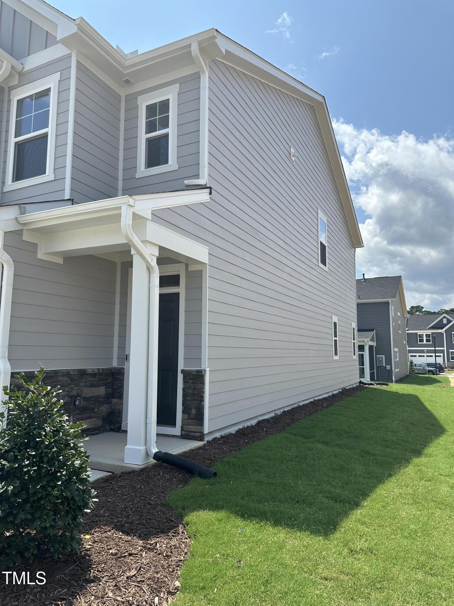 1726 Barrett Run Trail Apex, NC 27502 - Photo 6 of 50 a front view of a house with a garden