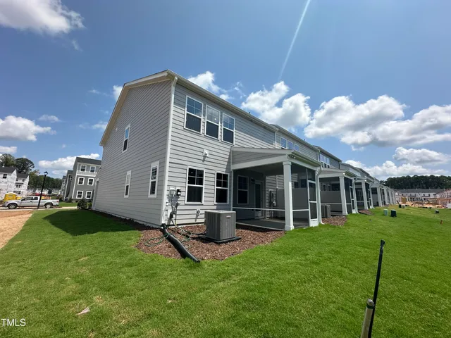 a view of a house with a yard porch and sitting area