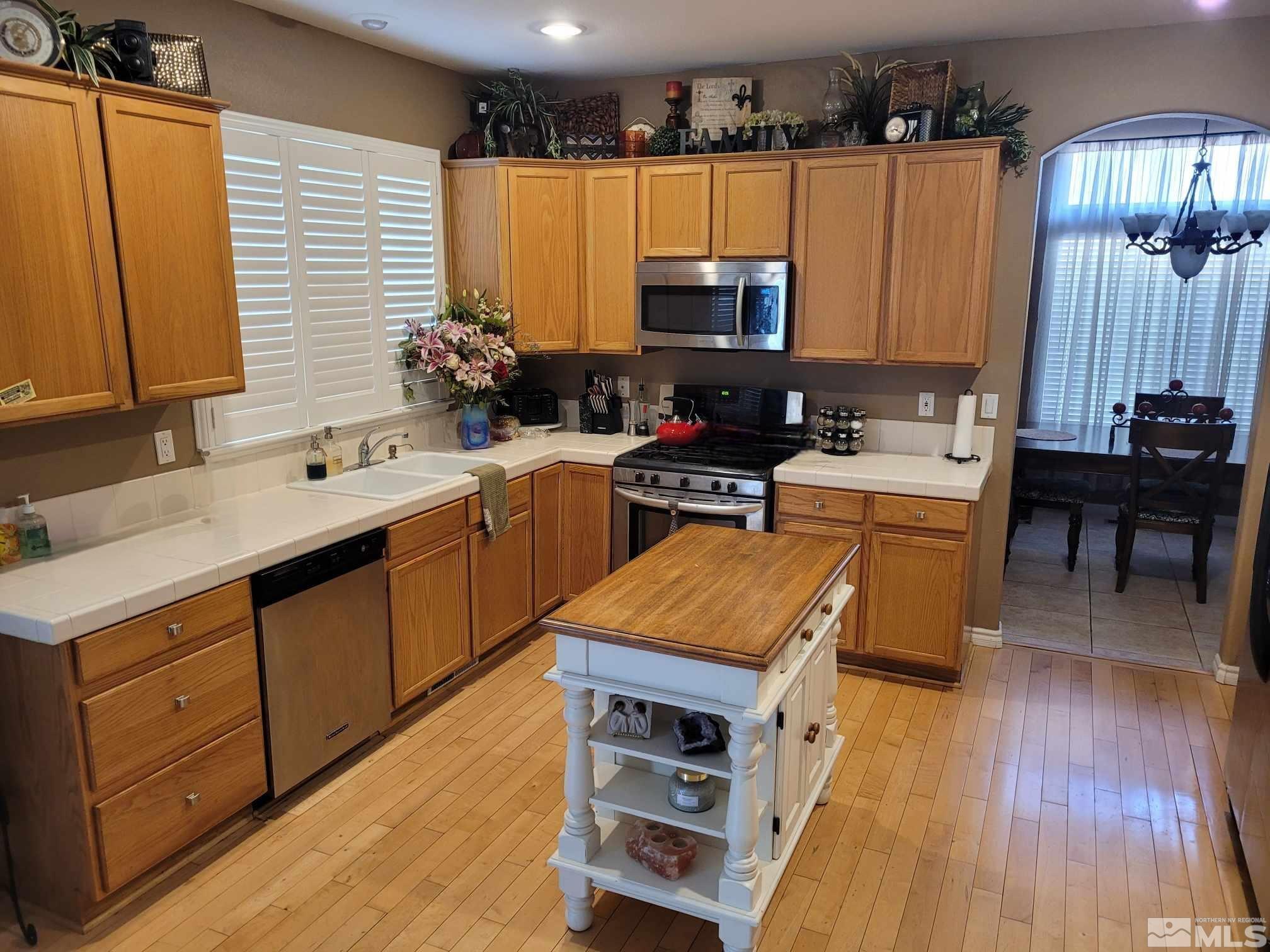 1921 Stargaze Way Reno, NV 89523 - Photo 8 of 26 a kitchen with a sink stove and cabinets