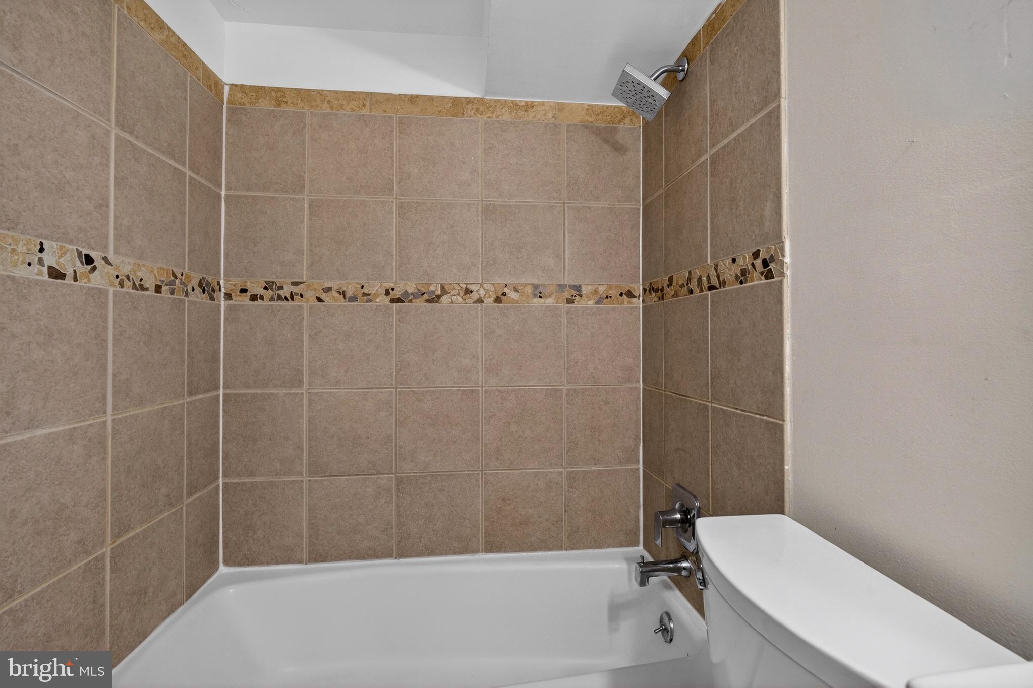 1351 Monroe Street Northwest Washington, DC 20010 - Photo 13 of 23 a bathroom with a toilet and shower