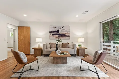 a view of a dining room with furniture window and wooden floor