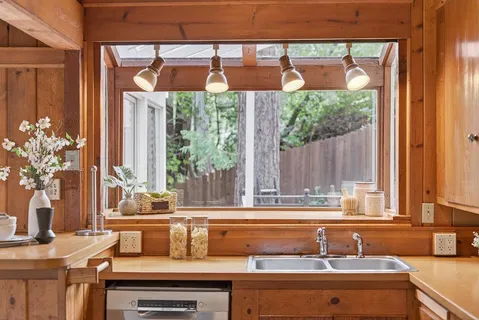 a bathroom with a sink toilet and mirror