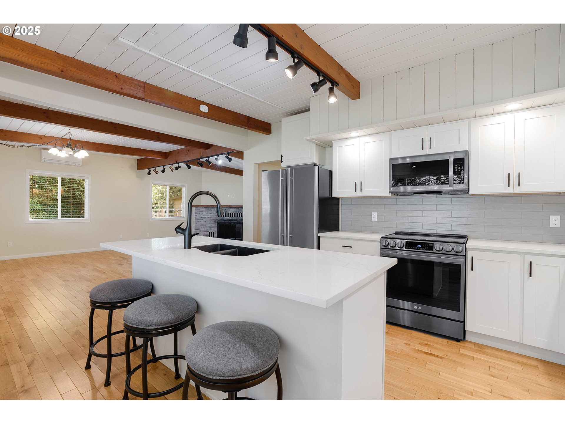 12950 South New Era Road Oregon City, OR 97045 - Photo 11 of 45 a kitchen with cabinets and chairs