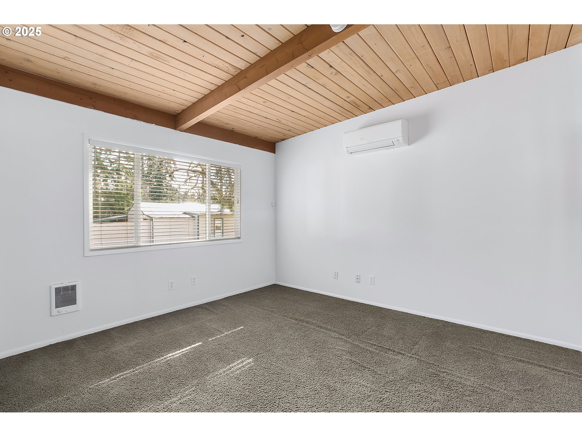 12950 South New Era Road Oregon City, OR 97045 - Photo 16 of 45 a view of an empty room with wooden floor and a window