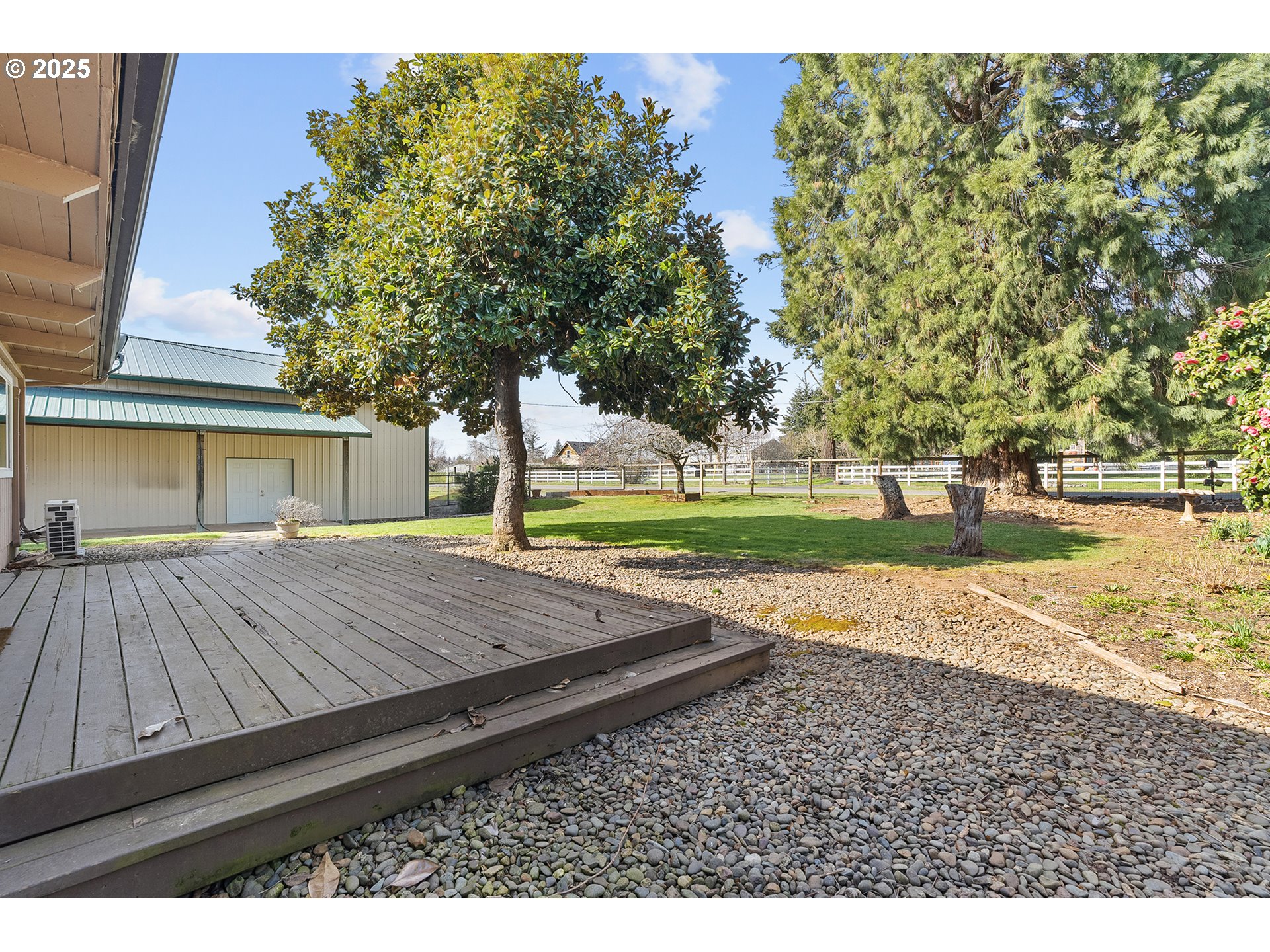 12950 South New Era Road Oregon City, OR 97045 - Photo 19 of 45 a view of a backyard with large trees
